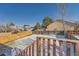 Fenced backyard with a deck and snowy ground at 2808 S Fundy St, Aurora, CO 80013