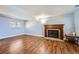 Bright basement room with wood floors and a cozy fireplace at 2808 S Fundy St, Aurora, CO 80013