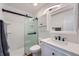 Updated bathroom with white vanity, frameless shower, and modern fixtures at 2808 S Fundy St, Aurora, CO 80013