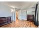 Bedroom with wood floors, double closets, and neutral walls at 2808 S Fundy St, Aurora, CO 80013