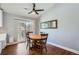 Dining area with a round table and four chairs, located next to a kitchen at 2808 S Fundy St, Aurora, CO 80013