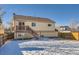 Back exterior of house with deck and stairs at 2808 S Fundy St, Aurora, CO 80013