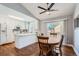 Modern kitchen with white cabinets, white countertops, and stainless steel appliances at 2808 S Fundy St, Aurora, CO 80013