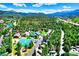 Expansive aerial view showcasing the community amidst lush greenery and scenic mountain views at 85 Revett Dr # 40, Breckenridge, CO 80424