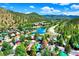 Beautiful aerial view of a mountain community with a lake, surrounded by lush forests and scenic landscapes at 85 Revett Dr # 40, Breckenridge, CO 80424