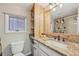 Updated bathroom with new vanity, stone countertop and decorative moose-themed shower curtain at 85 Revett Dr # 40, Breckenridge, CO 80424