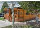 Well-kept log cabin with inviting covered porch, accented by mature trees and landscaping at 85 Revett Dr # 40, Breckenridge, CO 80424