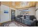 Inviting living room with knotty pine ceiling, plush seating, and wood-look floors offers a cozy retreat at 85 Revett Dr # 40, Breckenridge, CO 80424