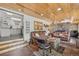 Comfortable living space featuring wood ceiling, open layout, and rustic accents, leading to kitchen at 85 Revett Dr # 40, Breckenridge, CO 80424