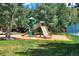 Charming community playground with slides, surrounded by trees, perfect for Gathering fun and recreation at 85 Revett Dr # 40, Breckenridge, CO 80424