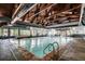 Indoor pool area with ample natural light, ideal for year-round relaxation and recreation at 85 Revett Dr # 40, Breckenridge, CO 80424