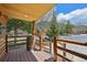 Welcoming covered porch with wooden railing and charming rustic decor featuring a barrel at 85 Revett Dr # 40, Breckenridge, CO 80424