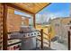 Covered deck with a stainless steel grill, ideal for outdoor cooking and entertaining guests at 85 Revett Dr # 40, Breckenridge, CO 80424