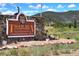 Welcoming sign for Tiger Run R.V. Resort, a recreational facility with lush greenery in background at 85 Revett Dr # 40, Breckenridge, CO 80424