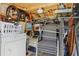 Storage area filled with supplies and stacked furniture; laundry machines present at 85 Revett Dr # 40, Breckenridge, CO 80424