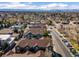 Aerial view of townhomes nestled in a community setting with mountain views and easy access to urban amenities at 7422 E 7Th Ave # 14, Denver, CO 80230
