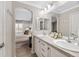 Bathroom with double sinks, tile floor and doorway into the main bedroom area at 7422 E 7Th Ave # 14, Denver, CO 80230