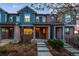Attractive townhouse exteriors with brick and blue siding, and steps leading to the front door at 7422 E 7Th Ave # 14, Denver, CO 80230