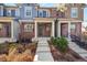 Charming townhome with brick accents, well-maintained landscaping, and a welcoming front porch at 7422 E 7Th Ave # 14, Denver, CO 80230