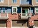 Charming townhome garages with brick trim, balconies, and lots of natural light at 7422 E 7Th Ave # 14, Denver, CO 80230