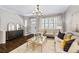 Inviting living room with hardwood floors, modern furnishings, staircase, and ample natural light at 7422 E 7Th Ave # 14, Denver, CO 80230