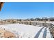 Snowy backyard with a wooden fence and a patio at 11898 Discovery Cir, Parker, CO 80138