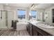 Main bathroom with soaking tub, double vanity, and shower at 11898 Discovery Cir, Parker, CO 80138