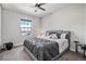 Main bedroom with a king bed and ceiling fan at 11898 Discovery Cir, Parker, CO 80138