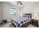 Bedroom with a queen bed and window seat at 11898 Discovery Cir, Parker, CO 80138