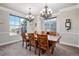 Elegant dining room with chandelier and large windows at 11898 Discovery Cir, Parker, CO 80138