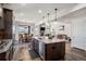 Kitchen with an island, stainless steel appliances, and hardwood floors at 11898 Discovery Cir, Parker, CO 80138