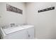 Laundry room with washer, dryer, and hanging rack at 11898 Discovery Cir, Parker, CO 80138