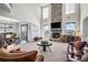 Open living space featuring a fireplace and high ceilings at 11898 Discovery Cir, Parker, CO 80138