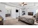 Main bedroom with ensuite bathroom and large TV at 11898 Discovery Cir, Parker, CO 80138