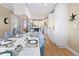 Modern kitchen with white cabinetry, stainless steel appliances, and a large island at 7107 E Costilla Dr, Centennial, CO 80112