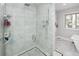 Large walk-in shower with marble tile and glass enclosure at 7107 E Costilla Dr, Centennial, CO 80112