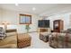 Cozy finished basement featuring carpet flooring, a TV area, and neutral-colored walls at 9839 Foxhill Cir, Highlands Ranch, CO 80129