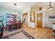 Elegant dining room featuring hardwood floors, a wood table set, china cabinet, and decorative lighting fixtures at 9839 Foxhill Cir, Highlands Ranch, CO 80129