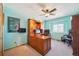 Comfortable office space featuring a ceiling fan, carpet flooring, and natural lighting at 9839 Foxhill Cir, Highlands Ranch, CO 80129