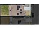 Aerial perspective of home with solar panels, fenced backyard, and a paved driveway at 13221 E 110Th Pl, Commerce City, CO 80022