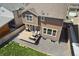 An aerial view of a home's backyard featuring a well-manicured lawn, spacious deck, and low-maintenance gravel area at 13221 E 110Th Pl, Commerce City, CO 80022