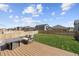 A well-maintained backyard featuring a spacious deck, cozy seating, and a lush lawn at 13221 E 110Th Pl, Commerce City, CO 80022