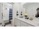 Bathroom featuring double vanity, and shower-tub combo at 13221 E 110Th Pl, Commerce City, CO 80022