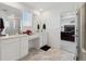 Bathroom featuring double vanity, linen closet, marble floors and bedroom access at 13221 E 110Th Pl, Commerce City, CO 80022