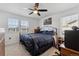 Bedroom with ceiling fan, double windows, study corner and closet at 13221 E 110Th Pl, Commerce City, CO 80022