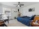Bedroom with study corner, natural light, and ceiling fan at 13221 E 110Th Pl, Commerce City, CO 80022