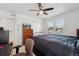 Bedroom with ceiling fan, double windows, closet, and computer corner at 13221 E 110Th Pl, Commerce City, CO 80022