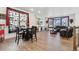 Open-concept living space with wood floors, dining area, a comfortable couch, and decorative accents at 13221 E 110Th Pl, Commerce City, CO 80022