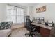 Office featuring chaise lounge, stylish chair, desk, natural light, and curtains at 13221 E 110Th Pl, Commerce City, CO 80022