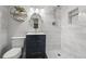 Modern basement bathroom with a walk-in shower, updated vanity, and hexagon tile floor at 3061 S Grant St, Englewood, CO 80113